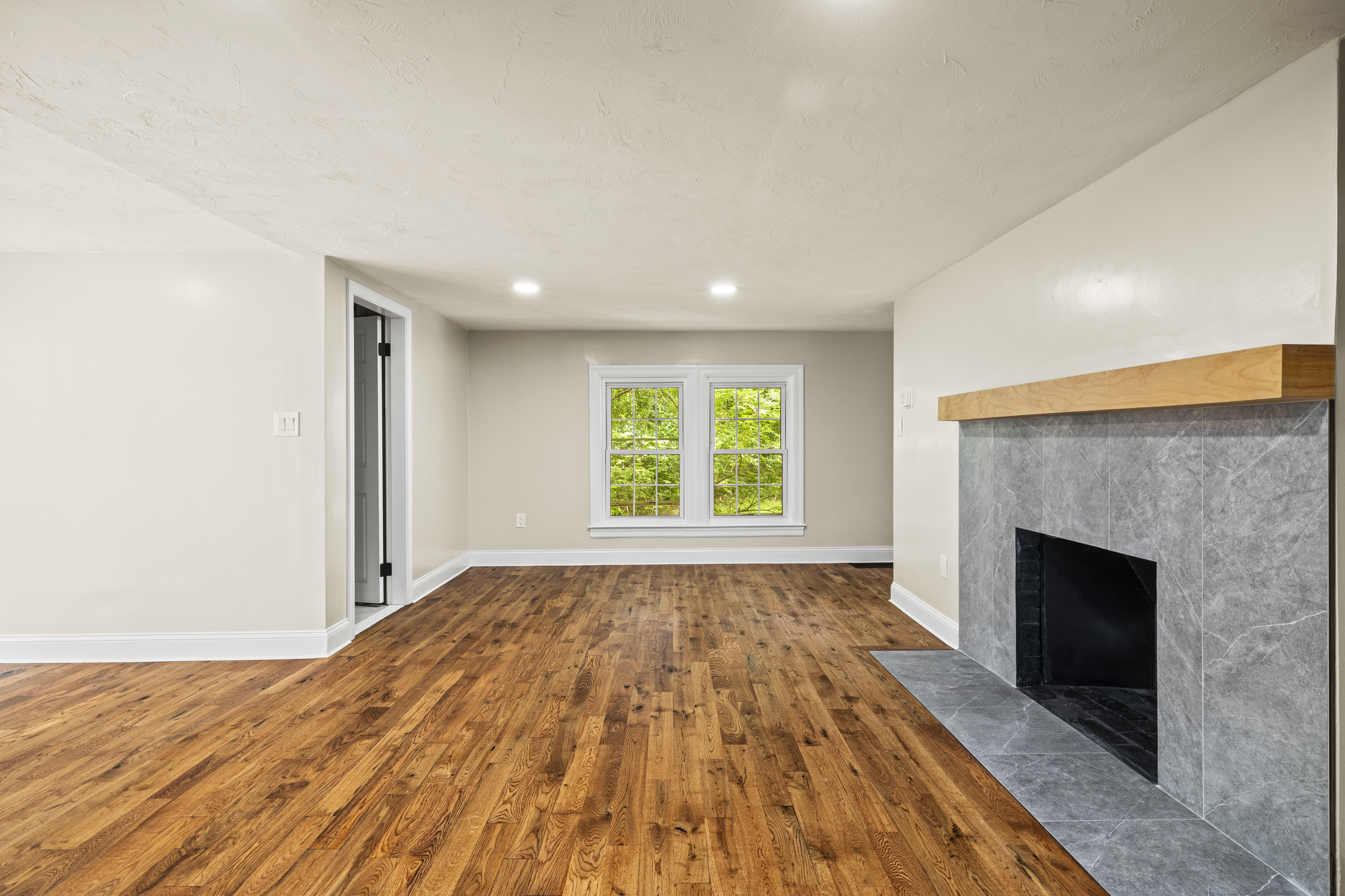 Framingham open room with fireplace and finished floors