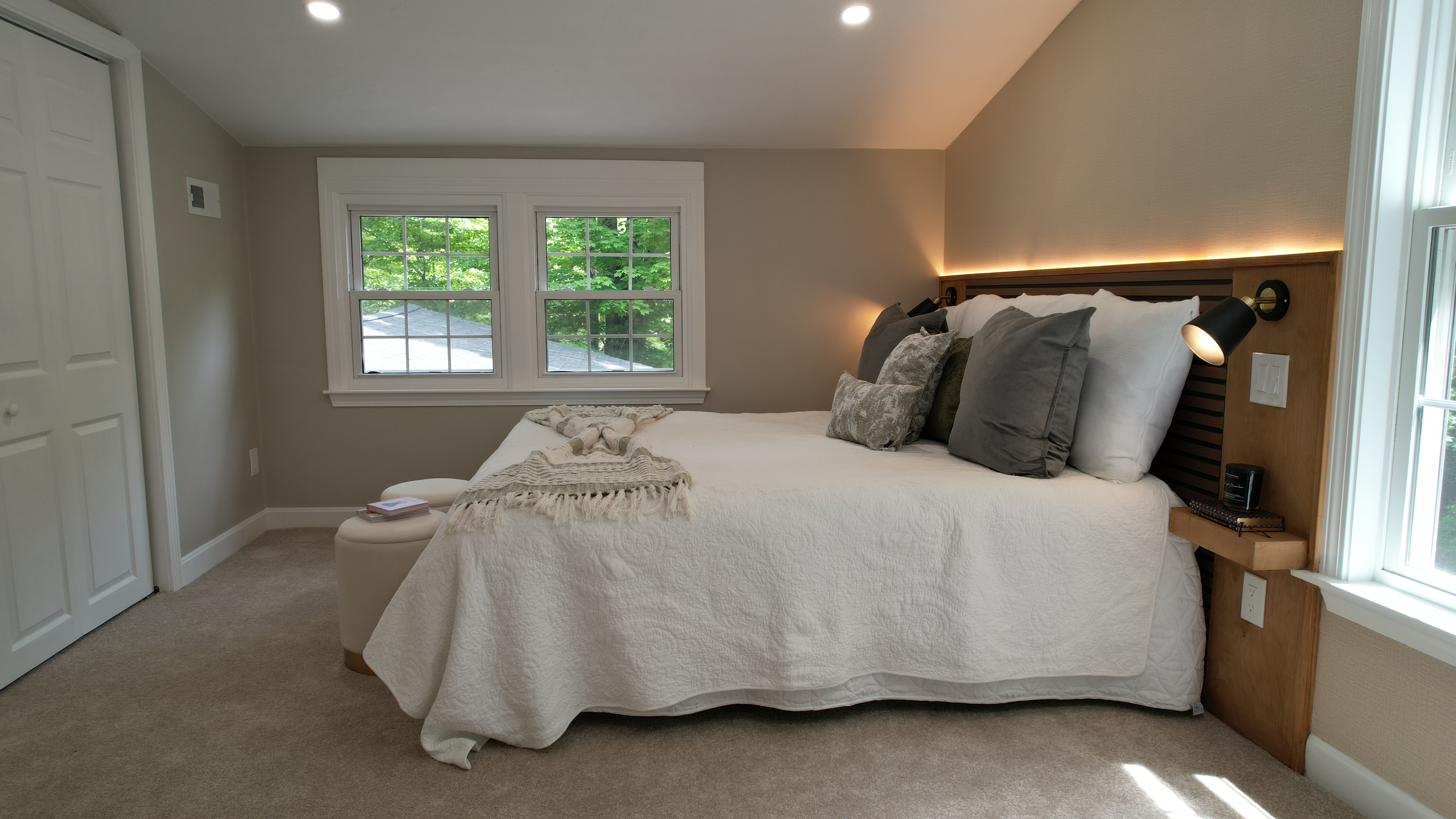 Framingham primary bedroom with custom headboard