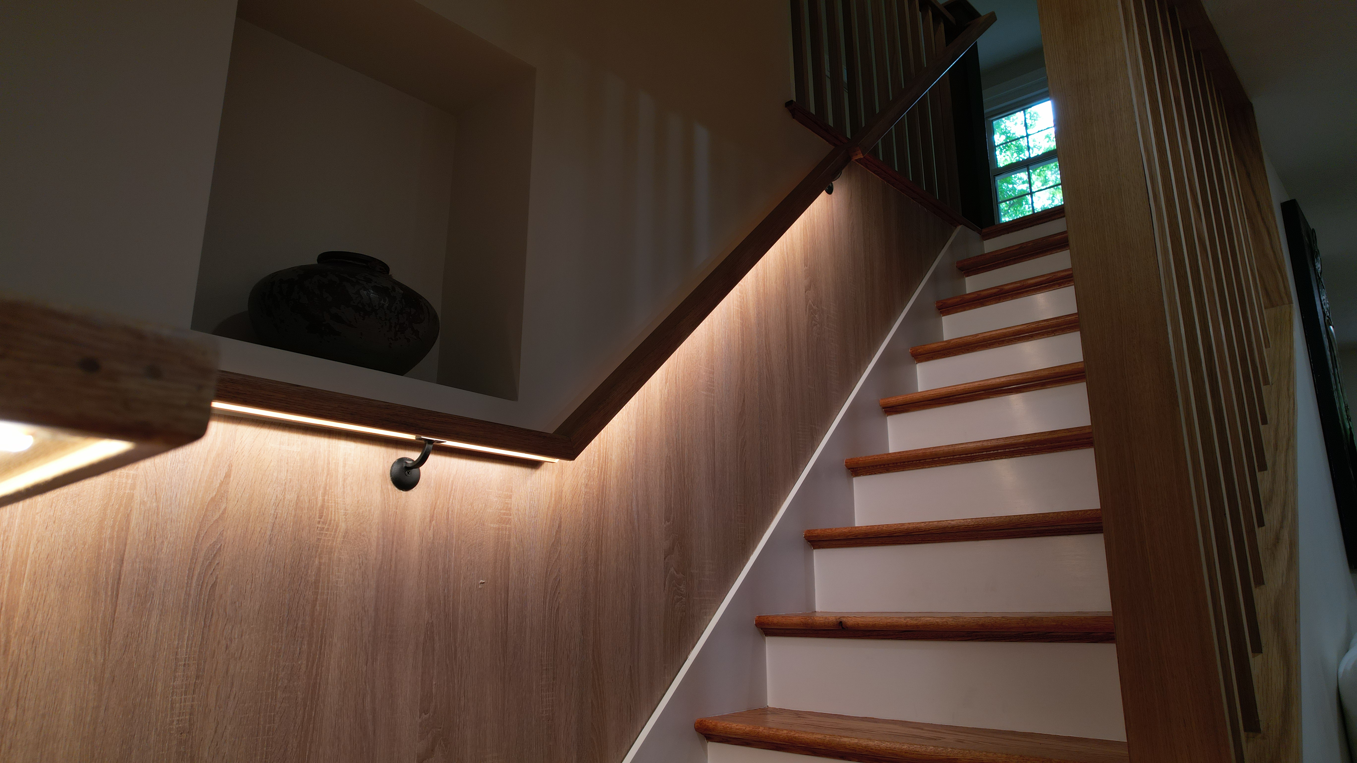 Framingham staircase with warm wood paneling