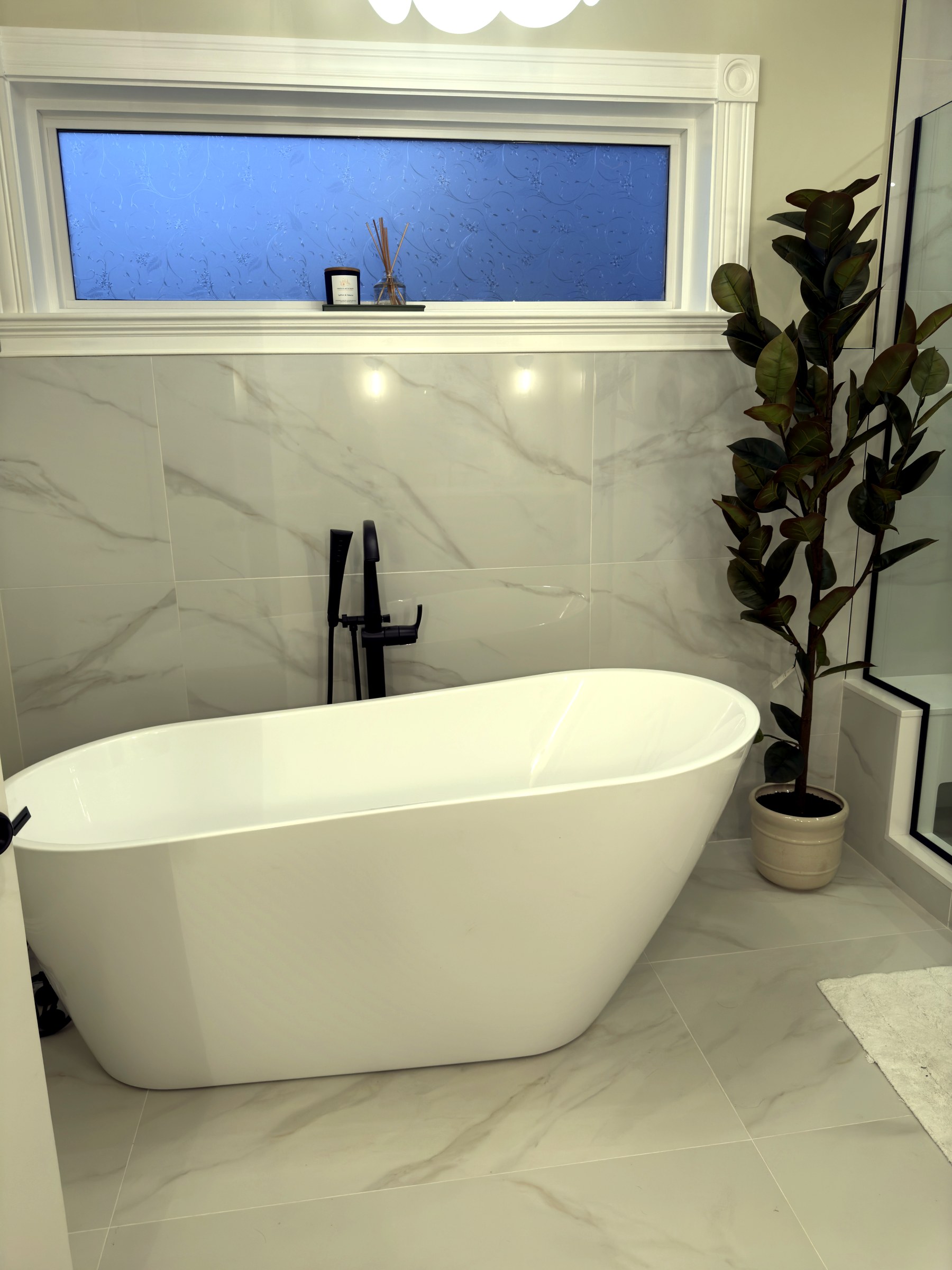 Milton freestanding tub and bathroom window
